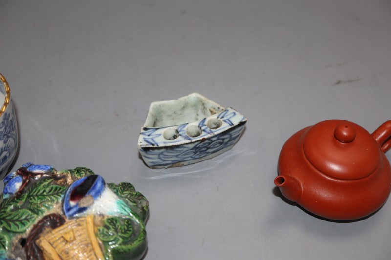 A group of Chinese porcelain including a Redware teapot, a blue and white tea cup and two other pieces